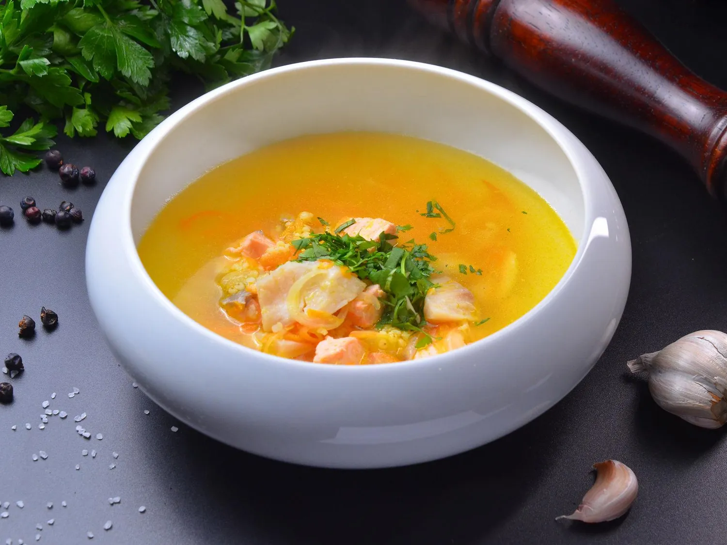 Уха из чёрной трески, нерки и палтуса с топинамбуром, пшеном и кинзой